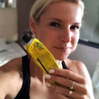 Athlete holds Thai cream in hand